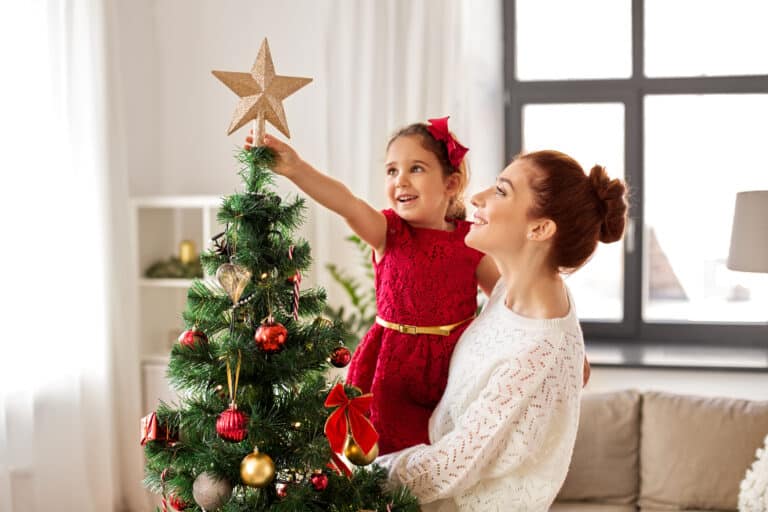 Family decorating Christmas tree